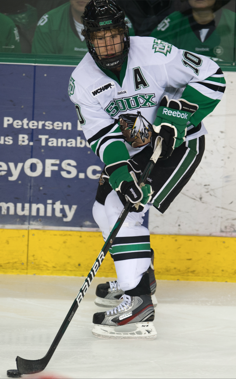 Why College Hockey Requires Players To Wear Full Cages